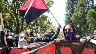 Antifa members and counter protesters gather during a rightwing No-To-Marxism rally on August 27, 2017 at Martin Luther King Jr. Park in Berkeley, California.