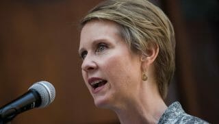 New York gubernatorial candidate Cynthia Nixon speaks about her campaign finance reform plan during a small news conference, outside the Old New York County Courthouse, June 18, 2018 in New York City. Nixon is running against incumbent governor Andrew Cuomo in the Democratic primary.