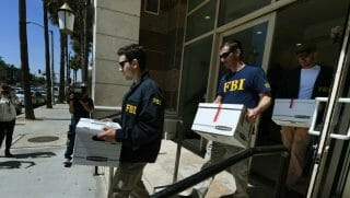 FBI agents remove boxes of documents from the offices of the California Investment Immigration Fund after serving search warrants in an investigation into an alleged USD 50 million high-end visa fraud scheme involving as many as 100 Chinese nationals in San Gabriel, California on April 5, 2017.