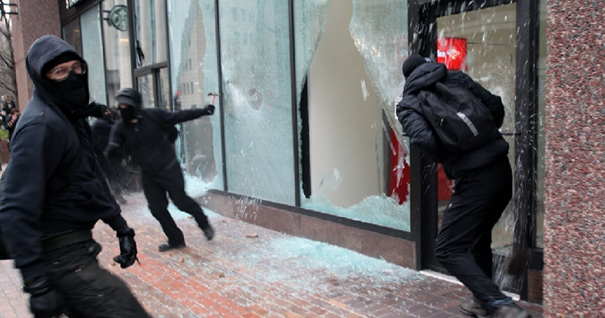 Rioters smash windows of a Bank of America and a Starbucks in Washington on the day of President Donald Trump's inauguration in 2017.