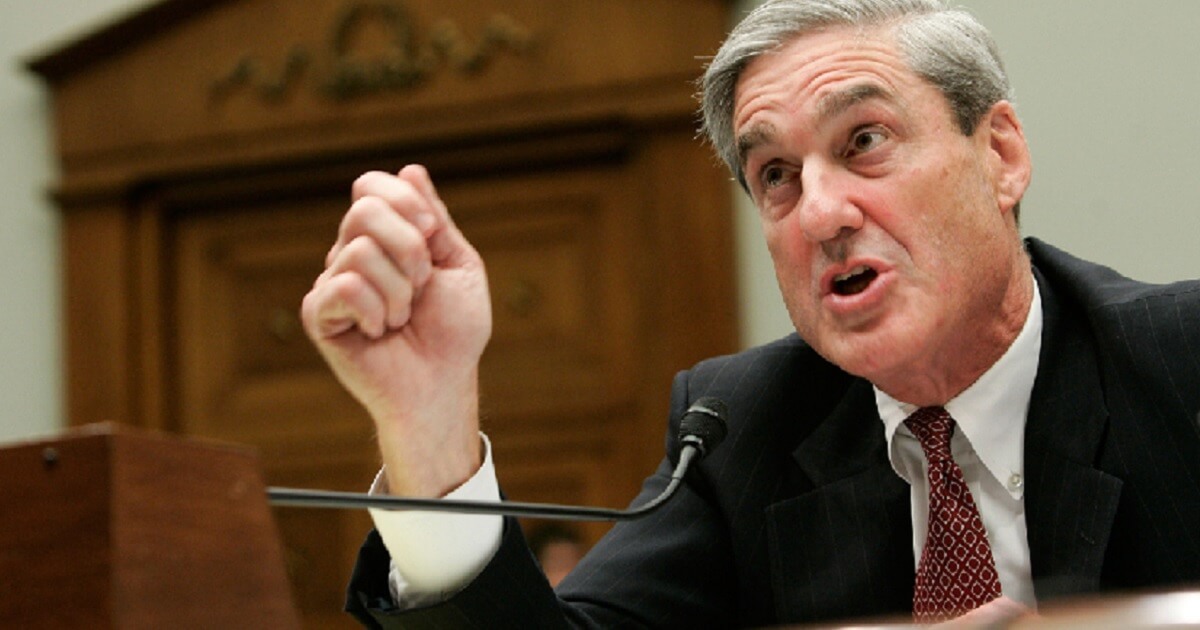 Robert Mueller gestures while testifying in front of Congress.