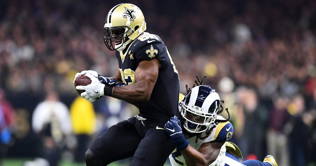 Benjamin Watson of the New Orleans Saints is tackled by the Los Angeles Rams' Mark Barron #26 of the Los Angeles Rams during a Nov. 4 game at the Mercedes Benz Superdome.