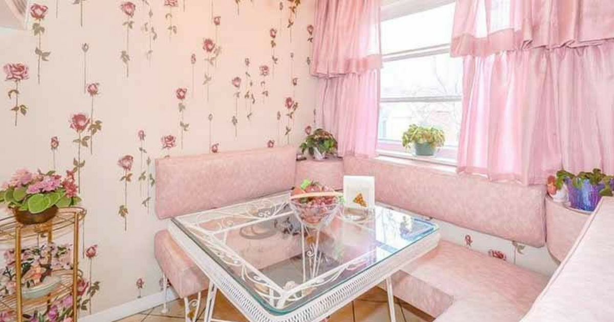 Image of a pink kitchen table and booth in a vintage Toronto home