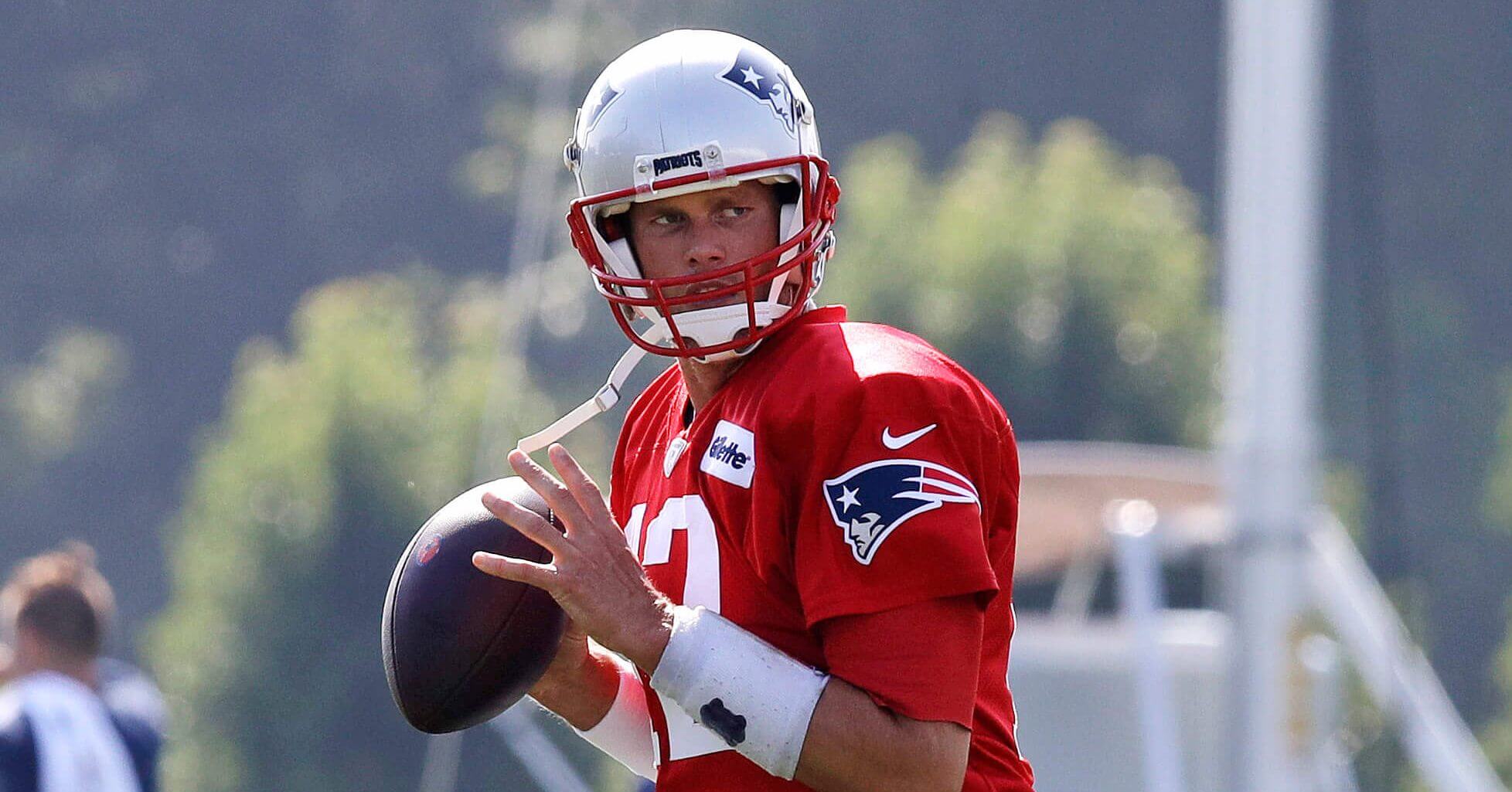 New England Patriots quarterback Tom Brady fades back to pass during the team's NFL football training camp.