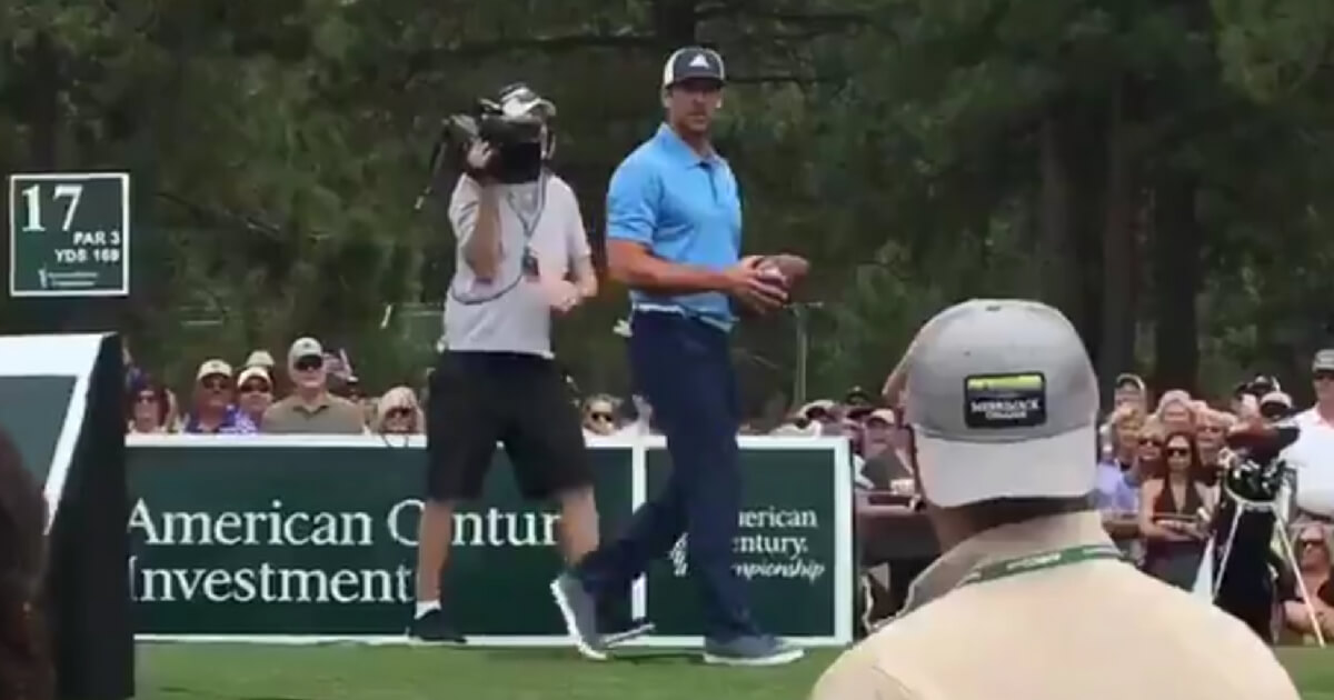 Green Bay Packers quarterback Aaron Rodgers took a timeout from the American Century Championship in Lake Tahoe to throw a pass to a fan on a boat.