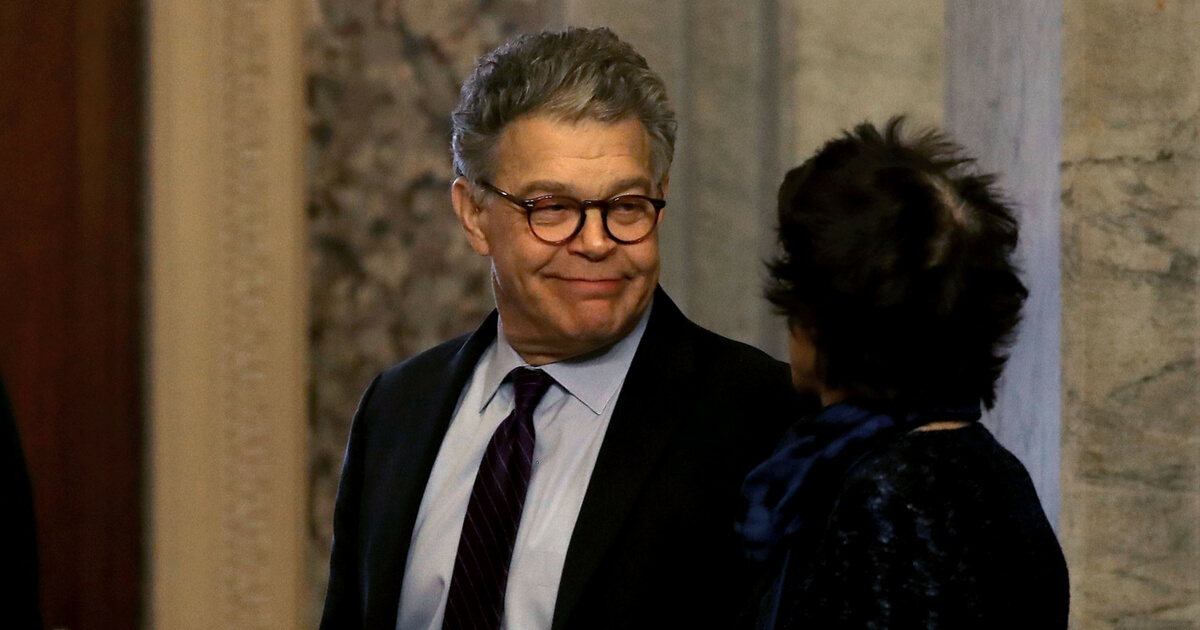 WASHINGTON, DC - DECEMBER 07: Sen. Al Franken (D-MN) looks at his wife Franni Bryson, before walking to the Senate chamber to announce his resignation, Capitol Hill, on December 7, 2017 on Capitol Hill in Washington, DC. A growing number of Senate Democtratic's pressured Franken to resign amid claims of sexual harassment.