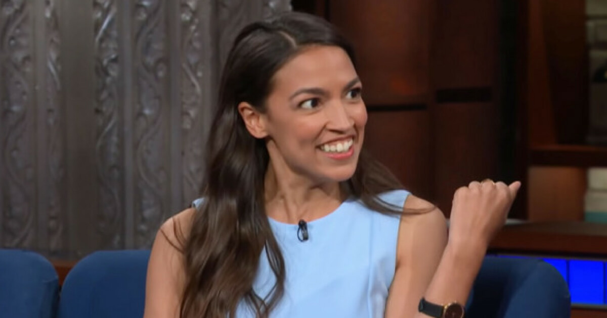 Alexandria Ocasio-Cortez holds news conference in front of the Wall Street bull