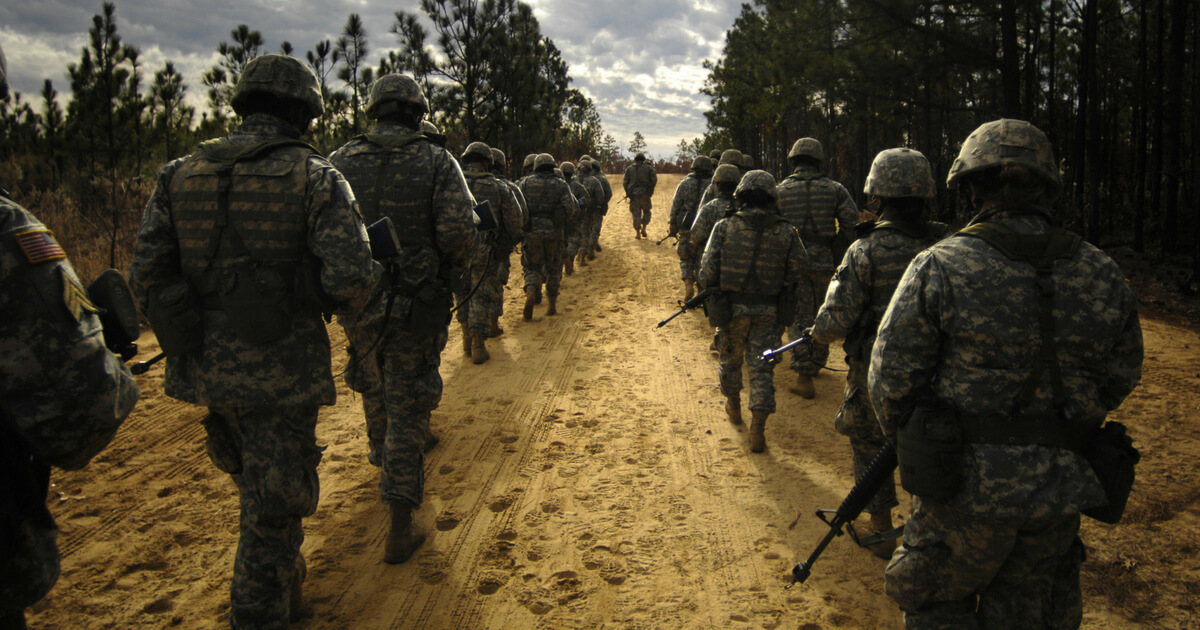 U.S. Army recruits practice patrol tactics while marching during U.S. Army basic training at Fort Jackson, S.C., Dec. 6, 2006.