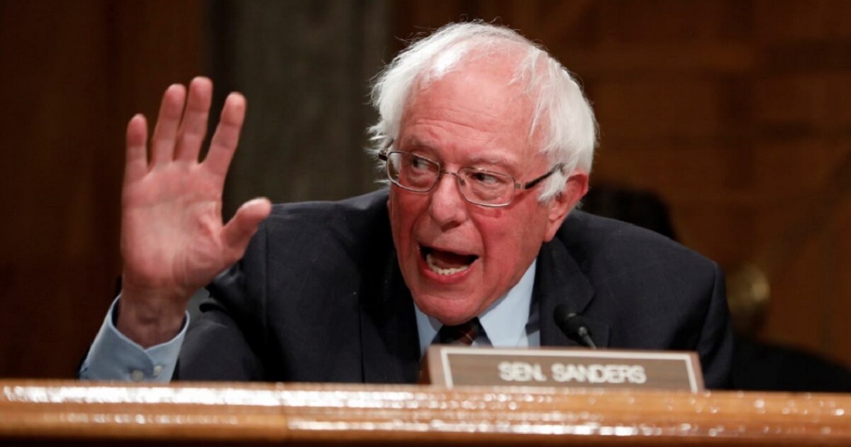 Bernie Sanders gesturing from seat