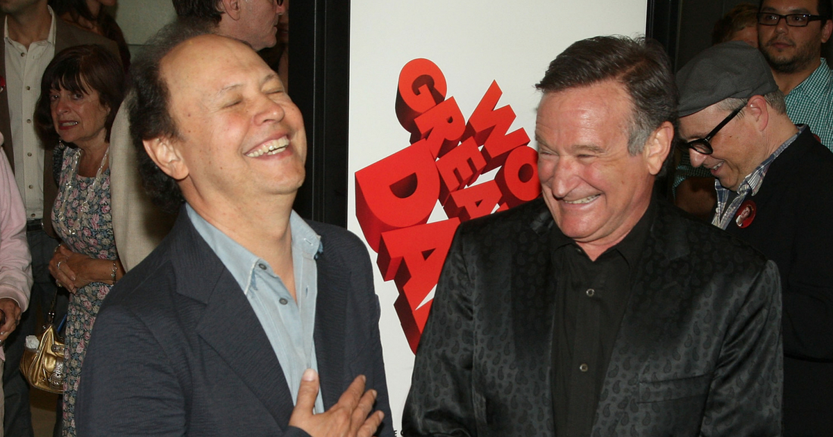 Billy Crystal and Robin Williams laughing