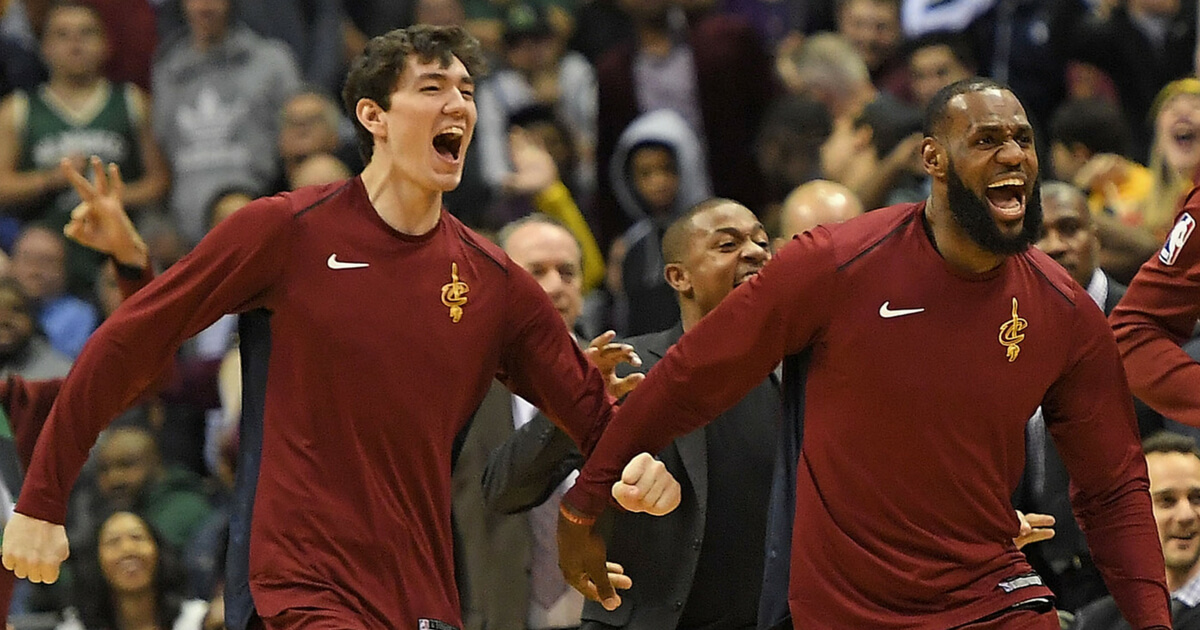 Cedi Osman (left) and LeBron James of the Cleveland Cavaliers celebrate a late score during a game against the Milwaukee Bucks at the Bradley Center on December 19, 2017 in Milwaukee, Wisconsin.