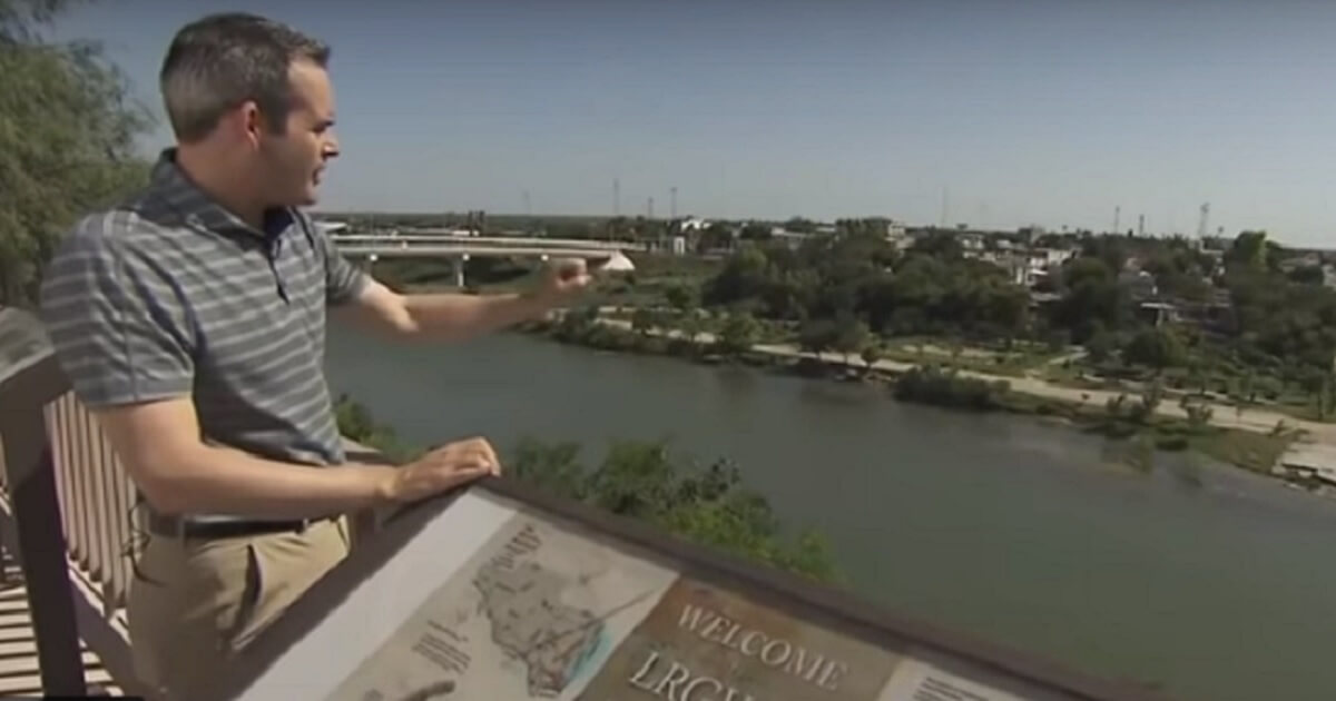 Reporter on stand overlooking the Rio Grande.