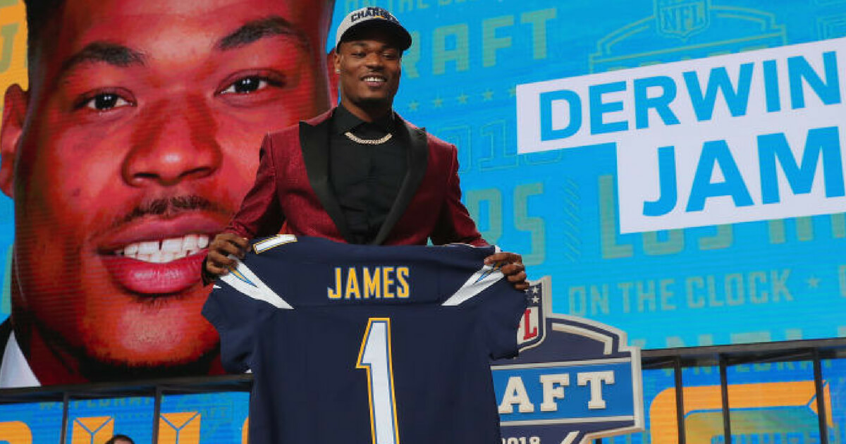 Derwin James poses for cameras after being selected in the first round of the 2018 NFL Draft by the Los Angeles Chargers
