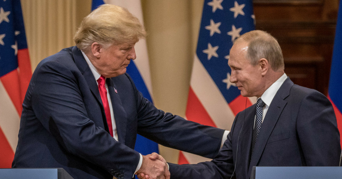 U.S. President Donald Trump (L) and Russian President Vladimir Putin shake hands during a joint press conference after their summit on July 16, 2018, in Helsinki, Finland.