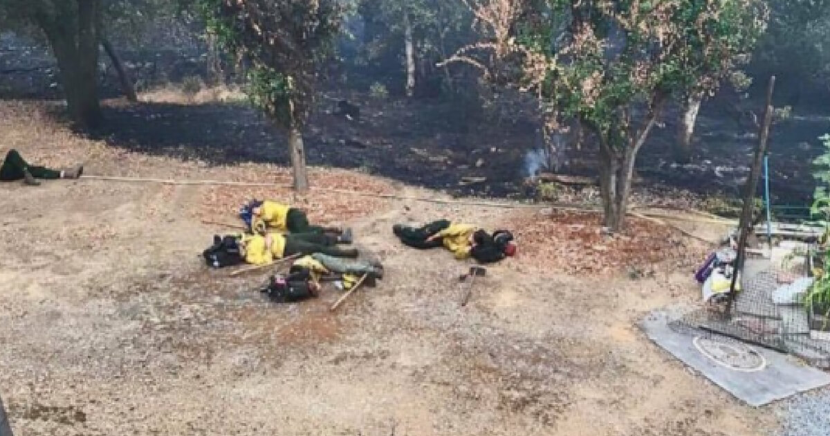 Firefighters sleep between fighting fires