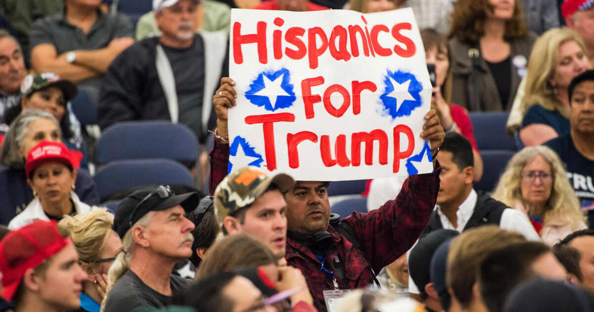 A man holds a sign reading 'Hispanics For Trump' at a campaign rally of the presumptive Republican presidential candidate Donald Trump on May 25, 2016 in Anaheim, California.