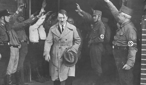 Adolf Hitler, leader of the National Socialists, leaves the party's Munich, Germany, headquarters on Dec. 5, 1931.