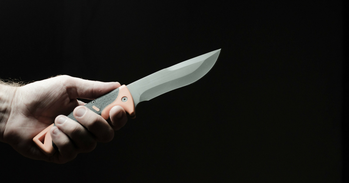 knife in a hand on dark background