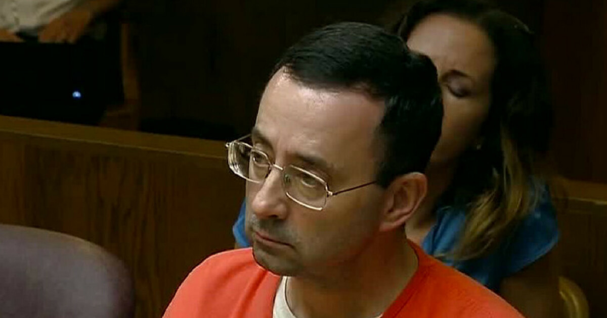 Convicted sex abuser Larry Nassar sits in court