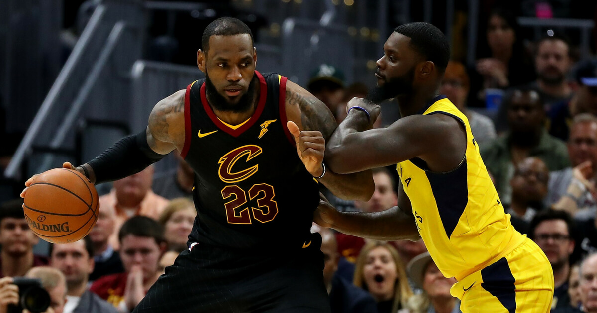 LeBron James of the Cleveland Cavaliers tries to get around Lance Stephenson of the Indiana Pacers during the first half in Game Seven of the Eastern Conference Quarterfinals during the 2018 NBA Playoffs at Quicken Loans Arena on April 29, 2018 in Cleveland.