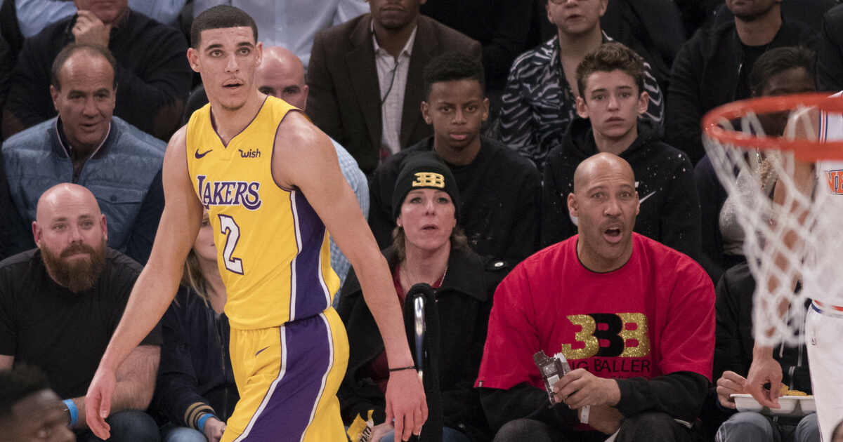 Lonzo Ball #2 of the Los Angeles Lakers with his father LaVar Ball and his mother Tina Ball during the game against the New York Knicks at Madison Square Garden on December 12, 2017 in New York City.