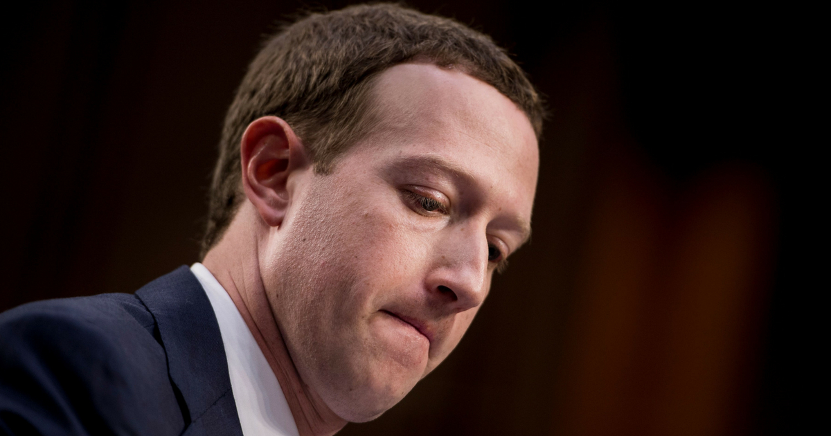TOPSHOT - Facebook CEO Mark Zuckerberg listens during a joint hearing of the Senate Commerce, Science and Transportation Committee and Senate Judiciary Committee on Capitol Hill April 10, 2018 in Washington, DC. Facebook chief Mark Zuckerberg took personal responsibility Tuesday for the leak of data on tens of millions of its users, while warning of an 'arms race' against Russian disinformation during a high stakes face-to-face with US lawmakers.