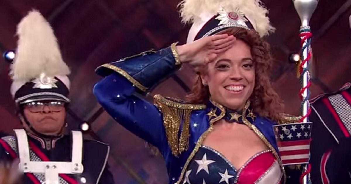 Comedian Michelle Wolfe dresses in patriotic colors and salutes during a "salute to abortion" skit on her Netflix Show "The Break with Michelle Wolf."