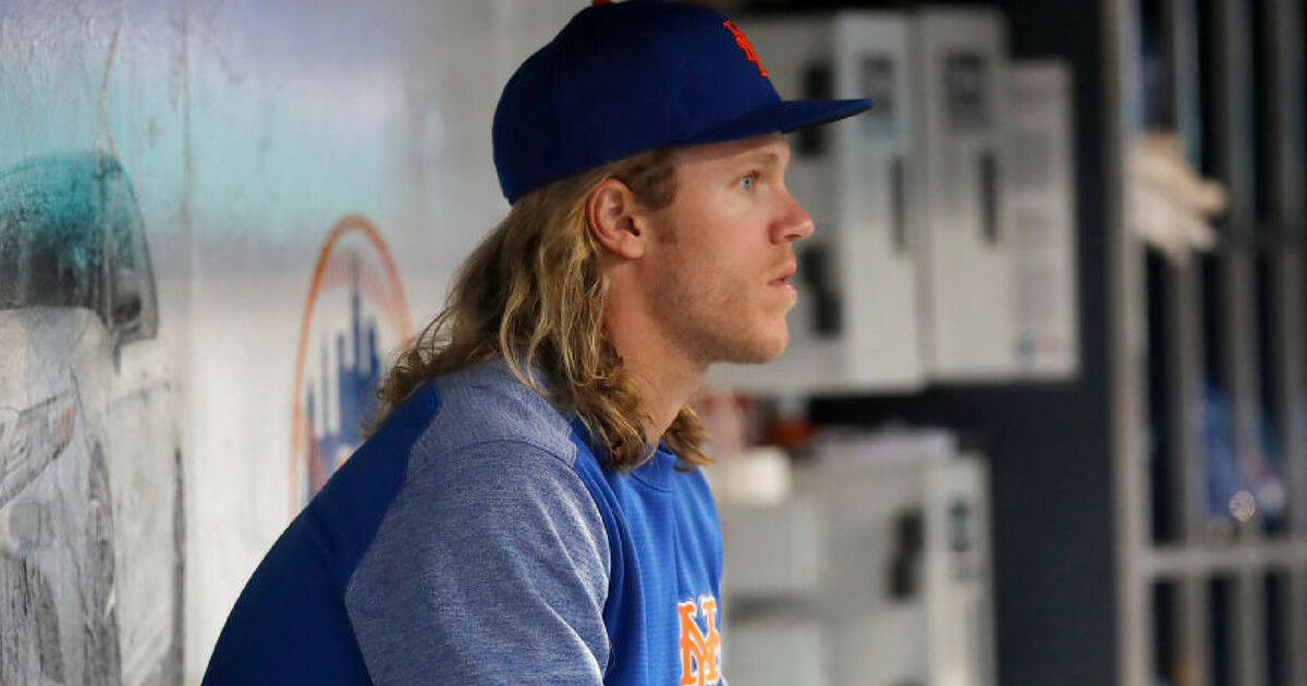 Mets pitcher Noah Syndergaard sitting in the dugout