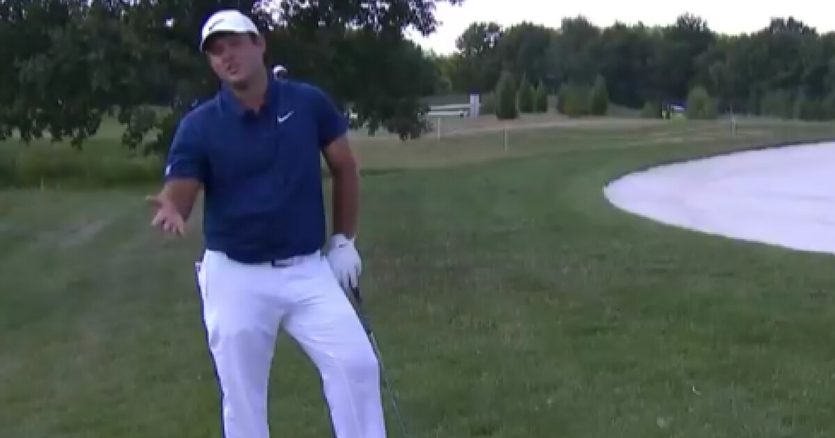 Patrick Reed yells at a camera crew for causing a distraction
