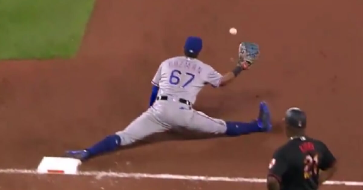 Texas first baseman Ronald Guzman does the splits to make a catch.