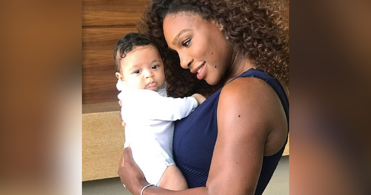 Serena Williams holds baby Olympia.