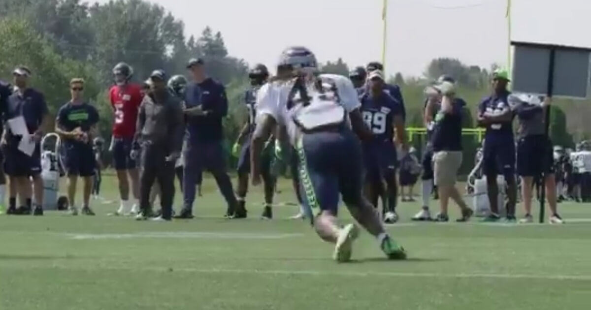 One-handed rookie Shaquem Griffin intercepted a pass from star quarterback Russell Wilson during Seattle Seahawks training camp.