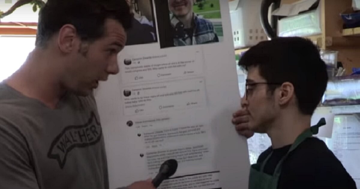 Pundit Steven Crowder holds microphone to activists face in a coffee shop.