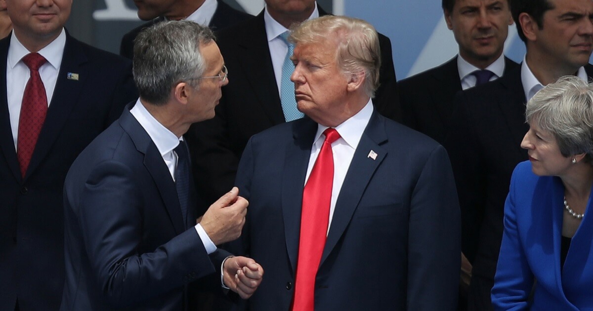 President Donald Trump exchanges words with NATO Secretary General Jens Stoltenberg at the opening ceremony of the 2018 NATO Summit on July 11, 2018 in Brussels, Belgium.