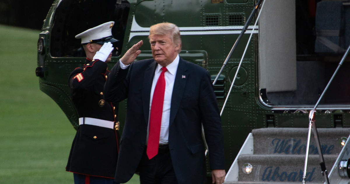 U.S. President Donald Trump salutes upon his return to the White House in Washington, D.C., on July 26, 2018.