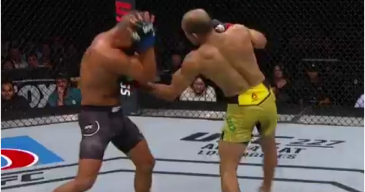 Jose Aldo lands a liver punch to Jeremy Stevens during their UFC match