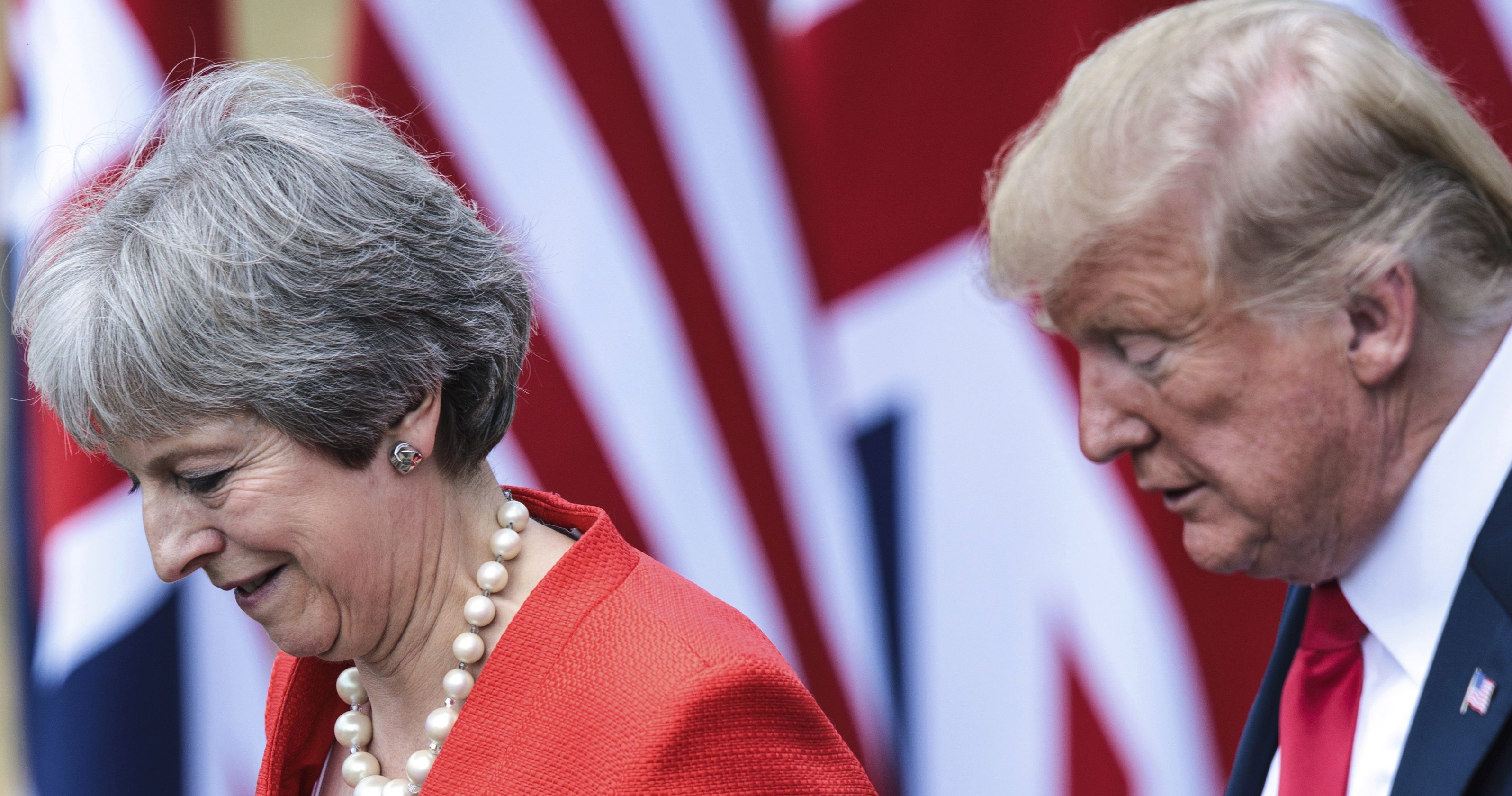 British Prime Minister Theresa May, left, and U.S. President Donald Trump attend a joint press conference following their meeting at Chequers, in Buckinghamshire, England, Friday, July 13, 2018.