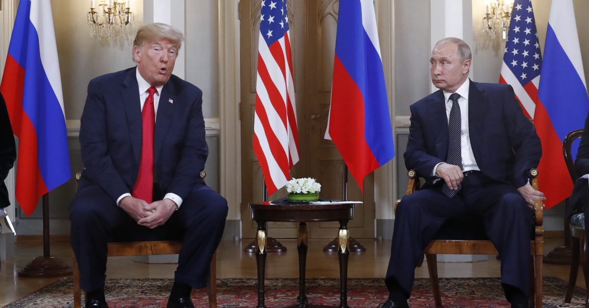 U.S. President Donald Trump gives a statement as Russian President Vladimir Putin looks on