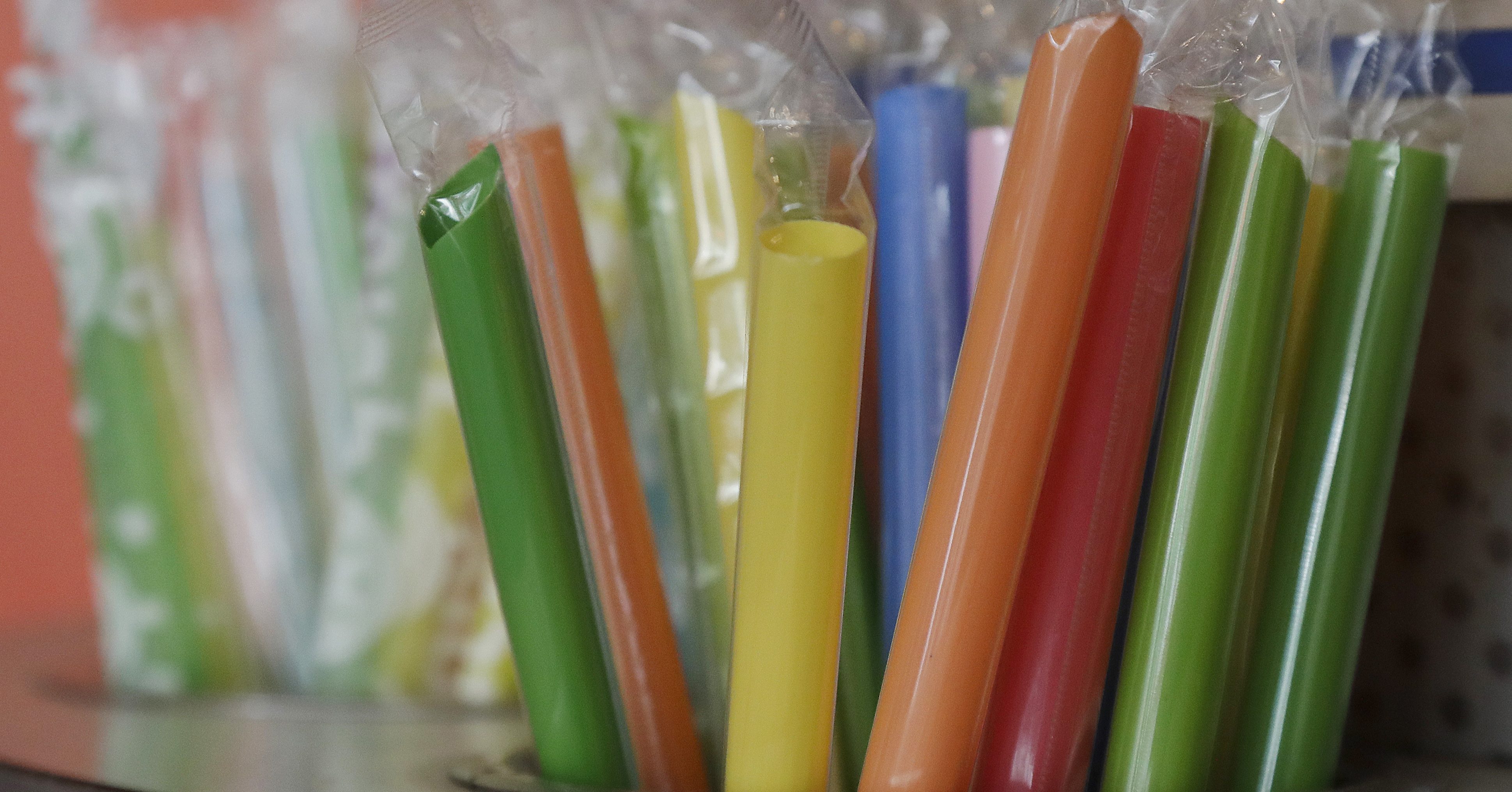 This July 17, 2018 photo shows wrapped plastic straws at a bubble tea cafe in San Francisco. Eco-conscious San Francisco joins the city of Seattle in banning plastic straws, along with tiny coffee stirrers and cup pluggers, as part of an effort to reduce plastic waste. It also makes single-use food and drink side items available upon request and phases out the use of fluorinated wrappers and to-go containers.