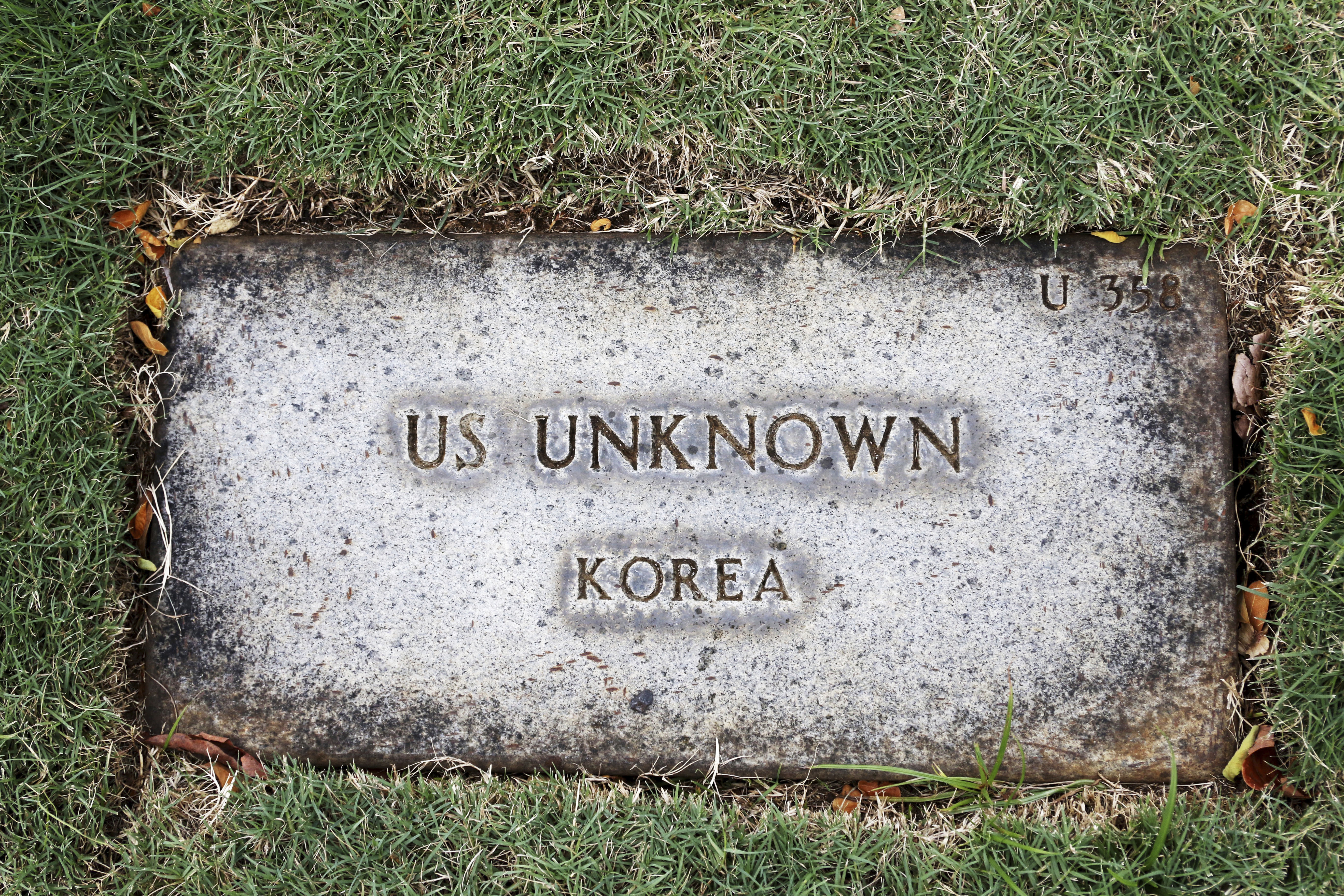 A grave marker for an unknown soldier from the Korean War is shown at the National Memorial Cemetery of the Pacific in Honolulu on Monday, July 30, 2018. Human remains handed over to the U.S. government from North Korea are expected to arrive Wednesday in Honolulu, where scientists will begin the painstaking process of trying to match DNA from the bones to those of American soldiers who didn't return from the Korean War more than a half century ago.