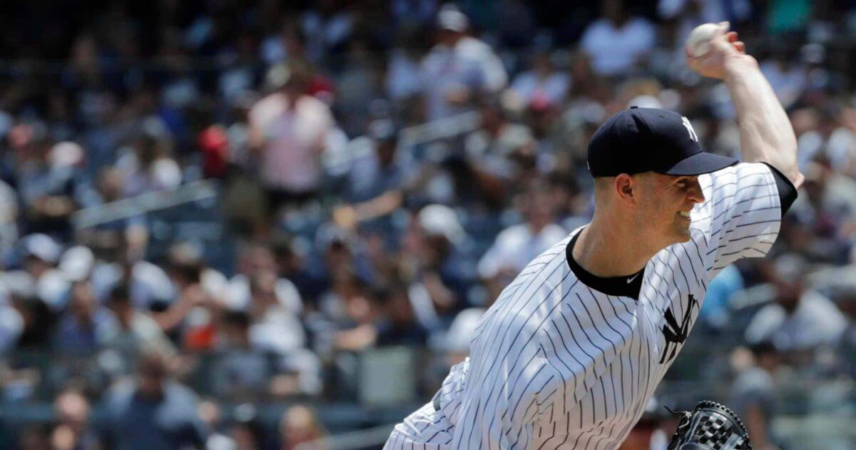 New York Yankees' J.A. Happ delivers a pitch against the Kansas City Royals