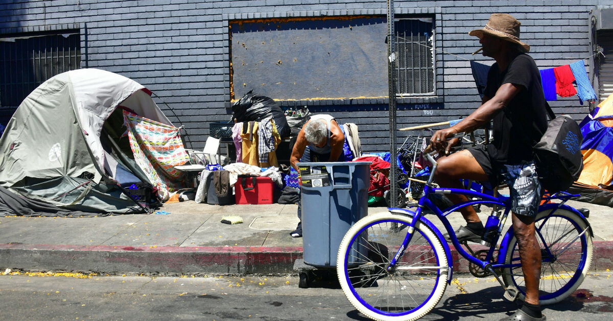 Tents and belongings of the homeless line a street in downtown Los Angeles, California