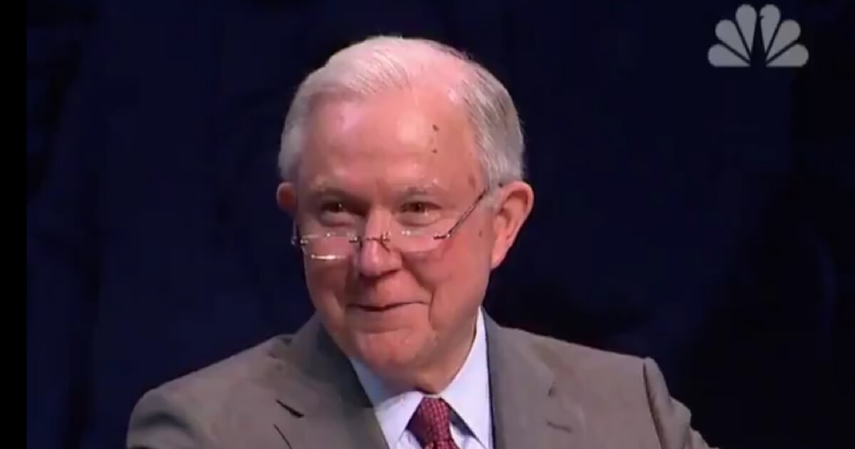 Jeff Sessions smiles while speaking at Turning Point USA conference