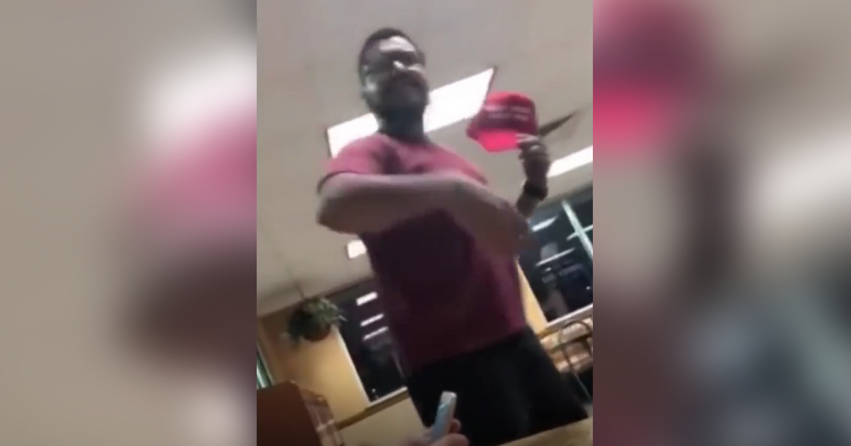 Man throws drink in teen's face and takes his hat.
