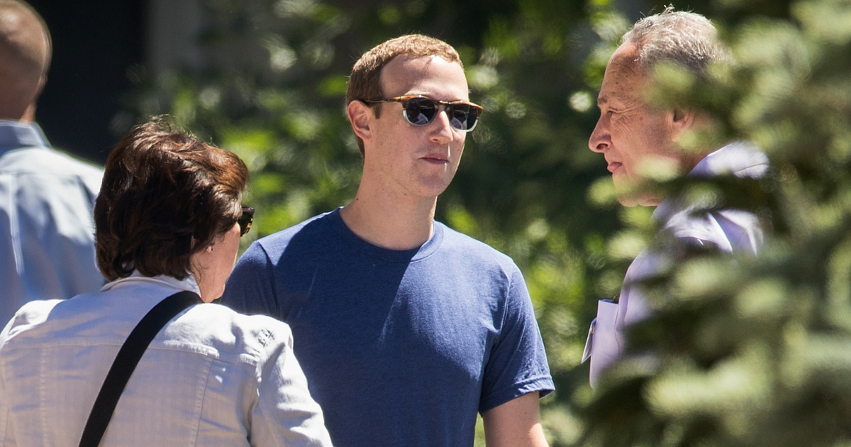 Mark Zuckerberg, chief executive officer of Facebook, talks with Senate Minority Leader Chuck Schumer