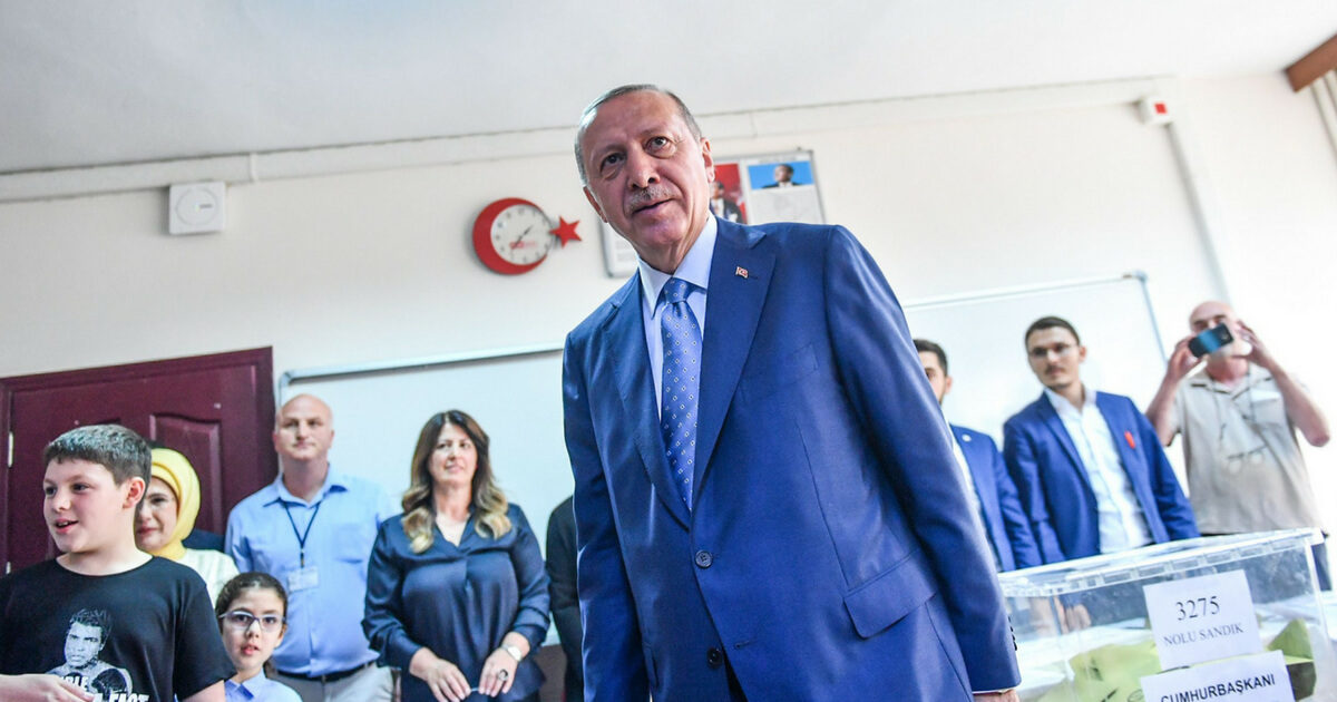 Recep Tayyip Erdogan votes at a polling station