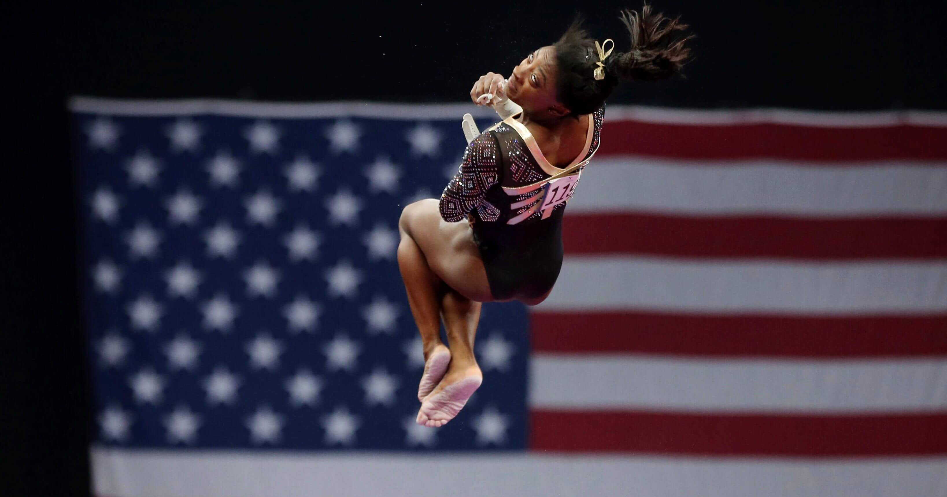 Simone Biles competes on the uneven bars at the U.S. Gymnastics Championships, Friday in Boston.
