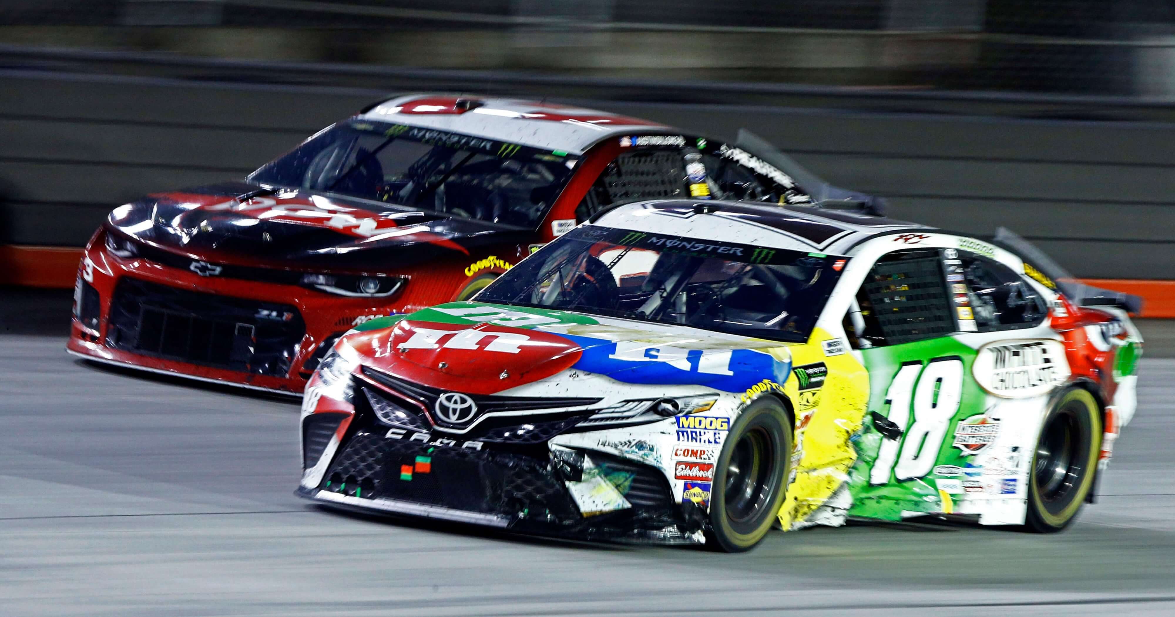 Kyle Busch (18) gets past Austin Dillon during the NASCAR Cup Series race Saturday in Bristol, Tenn.