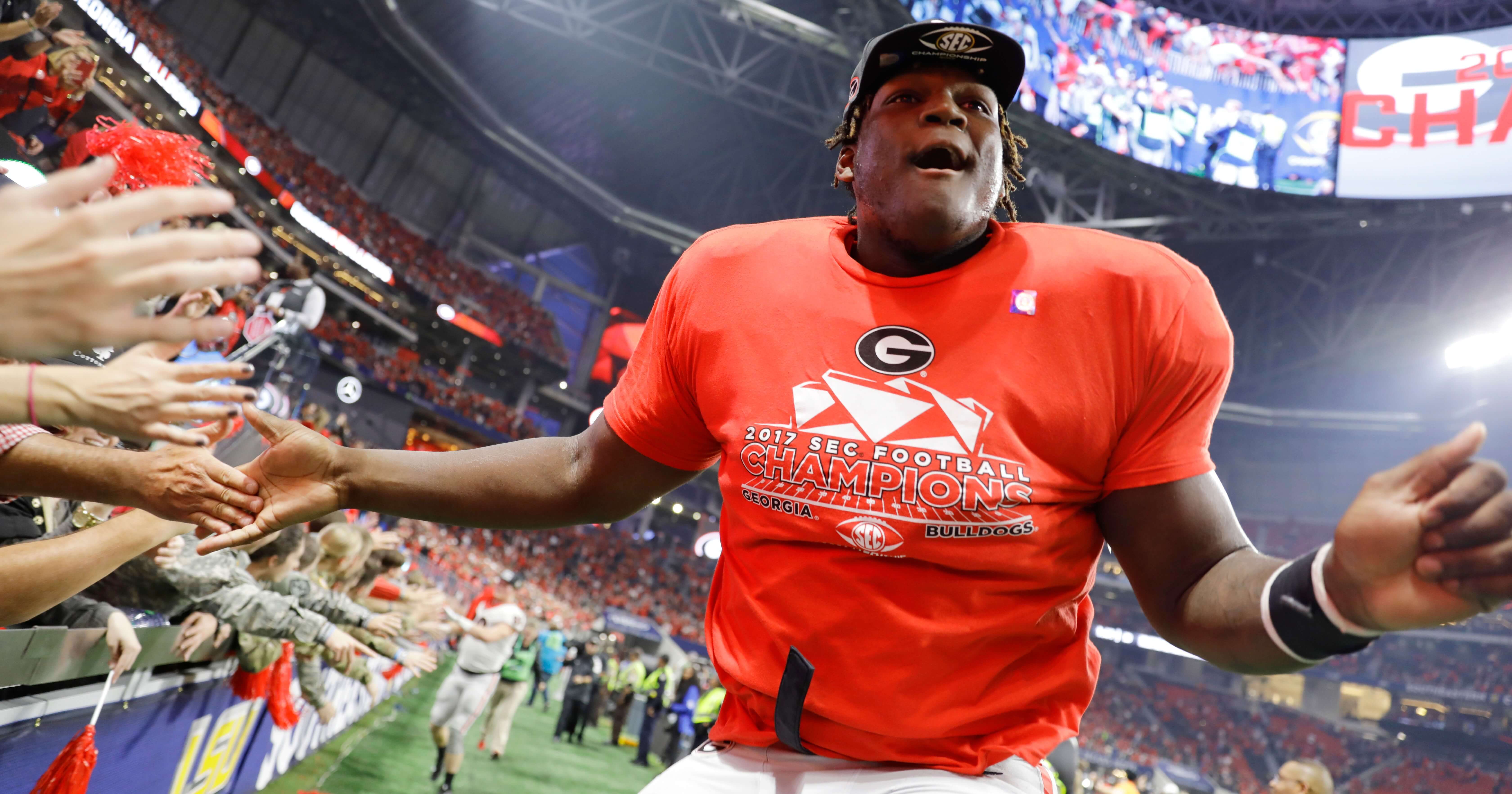 In this Dec. 2, 2017, file photo, Georgia offensive lineman Isaiah Wilson celebrates a Georgia win over Auburn in the Southeastern Conference championship NCAA college football game in Atlanta. Wilson has been working with Georgia’s first-team offense at right tackle for much of preseason camp as the Bulldogs attempt to replace New England Patriots first-round draft pick Isaiah Wynn, who was the starting left tackle last season.