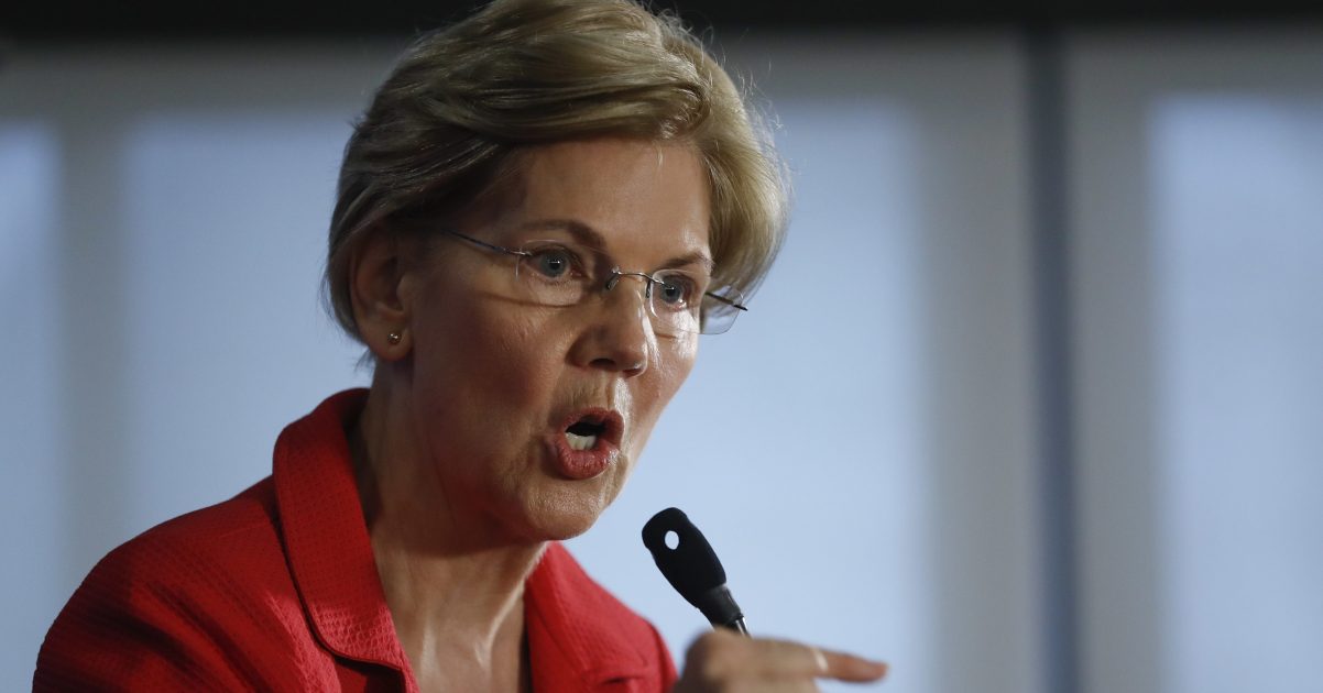 Sen. Elizabeth Warren, D-Mass., gestures while speaking at the National Press Club in Washington on Tuesday.